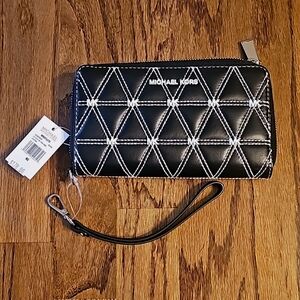 Michael Kors black studded zip around wallet with detachable wristlet strap.